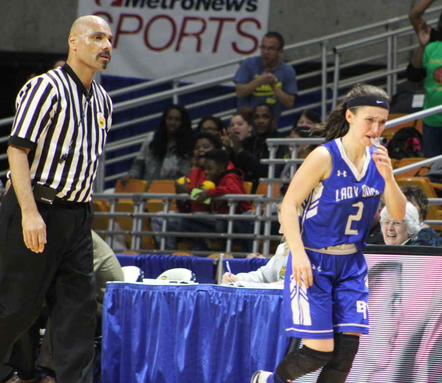 McClung exiting the court, after a "foul out" call by Official Peter Brogden